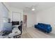 Spacious room with a desk setup, a comfortable sofa, and ample natural light streaming in at 8716 Hickorywood Ln, Tampa, FL 33615