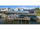 Private boat dock with covered boat lift on a sunny day, ready for waterfront adventures at 8716 Hickorywood Ln, Tampa, FL 33615