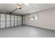Spacious garage with an automatic door opener, a window and ample room for parking and storage at 8716 Hickorywood Ln, Tampa, FL 33615