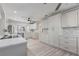 Bright updated kitchen with white cabinets, marble countertops, stainless appliances, and modern fixtures at 8716 Hickorywood Ln, Tampa, FL 33615
