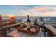 Enjoy a sunset view overlooking the ocean while sitting on the balcony with a bottle of wine at 8750 Harrell Ave, Treasure Island, FL 33706