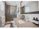 Modern bathroom with sleek fixtures, glass enclosed shower and tasteful decorative items at 8750 Harrell Ave, Treasure Island, FL 33706