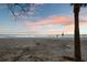Beautiful beachfront scene with pink and blue skies, creating a serene and inviting atmosphere at 8750 Harrell Ave, Treasure Island, FL 33706