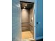 Private elevator with a light wood floor provides easy access to all levels of the home at 8750 Harrell Ave, Treasure Island, FL 33706