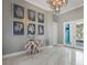 Elegant foyer with unique decor, stylish lighting, and gleaming marble floors, creating an inviting space at 8750 Harrell Ave, Treasure Island, FL 33706
