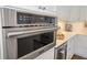 The kitchen features stainless steel appliances, and an in wall microwave at 8750 Harrell Ave, Treasure Island, FL 33706