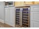 Kitchen wine fridge with a custom cabinet design at 8750 Harrell Ave, Treasure Island, FL 33706
