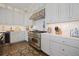 Well-equipped kitchen with a stainless steel range, custom cabinetry, and modern appliances at 8750 Harrell Ave, Treasure Island, FL 33706