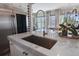 Kitchen sink and faucet with great views to the living area and outdoor pool at 8750 Harrell Ave, Treasure Island, FL 33706