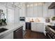 Bright kitchen features a large island, stainless steel wine cooler, and stainless steel appliances at 8750 Harrell Ave, Treasure Island, FL 33706