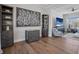 Modern living room showcasing dark wood floors and contemporary decor at 8750 Harrell Ave, Treasure Island, FL 33706