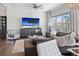 Cozy living room featuring a plush gray sectional, an ocean view, and modern coastal accents at 8750 Harrell Ave, Treasure Island, FL 33706