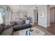 Open living room with hardwood floors, contemporary decor, modern furniture, and view to dining and kitchen at 8750 Harrell Ave, Treasure Island, FL 33706