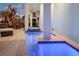 Outdoor oasis featuring a tranquil pool, spa, and lounge chairs, perfect for relaxation and entertaining at 8750 Harrell Ave, Treasure Island, FL 33706