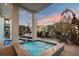 Charming outdoor space showcasing a cozy pool, spa, lounge chairs and ample seating near lush tropical landscaping at 8750 Harrell Ave, Treasure Island, FL 33706