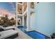 Inviting outdoor pool area featuring a spa, lounge chairs, and multi-level balconies at 8750 Harrell Ave, Treasure Island, FL 33706
