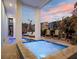 Charming outdoor space featuring a cozy pool, spa, lounge chairs and ample seating near lush landscaping at 8750 Harrell Ave, Treasure Island, FL 33706