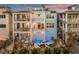 Luxury coastal home featuring multi-level balconies, a private pool, and stylish outdoor seating at 8750 Harrell Ave, Treasure Island, FL 33706