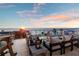 A comfortable rooftop deck offers scenic ocean views with cozy seating and an exercise bike at 8750 Harrell Ave, Treasure Island, FL 33706