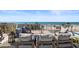 Relaxing rooftop deck offers ocean views, comfortable seating, and a tranquil ambiance at 8750 Harrell Ave, Treasure Island, FL 33706