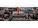 Relaxing rooftop patio with comfortable seating and ocean views at sunset at 8750 Harrell Ave, Treasure Island, FL 33706