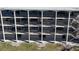 Balconies provide outdoor seating with views and direct access to condo units via exterior stairs at 12500 Capri Cir N # 302, Treasure Island, FL 33706