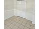 Bright bedroom with tile flooring and a closet at 12500 Capri Cir N # 302, Treasure Island, FL 33706