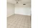Bright living room featuring tile flooring and a ceiling fan at 12500 Capri Cir N # 302, Treasure Island, FL 33706