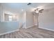 Open loft space with wood-look flooring and plenty of natural light at 16719 Delia St, Wimauma, FL 33598