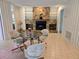 Inviting seating area featuring a stone fireplace and natural lighting at 2280 Toniwood Ln, Palm Harbor, FL 34685