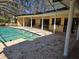 Screened-in pool with poolside entertaining and covered space, perfect for relaxation and leisure at 2280 Toniwood Ln, Palm Harbor, FL 34685