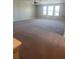 Spacious bedroom with carpeting, a ceiling fan, and multiple windows providing ample natural light at 2588 Bartolo Dr, Land O Lakes, FL 34639