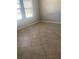 Well-lit room featuring tile flooring and a window at 2588 Bartolo Dr, Land O Lakes, FL 34639