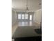 Bright and spacious living room featuring a tile floor, neutral color palette, and multiple windows for abundant natural light at 2588 Bartolo Dr, Land O Lakes, FL 34639