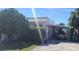 The exterior of this home has a car port and ample parking at 509 Rosery Nw Rd, Largo, FL 33770