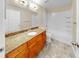 Bright bathroom featuring a granite vanity top, and tiled shower-tub combo at 700 S Harbour Island Blvd # 226, Tampa, FL 33602