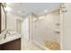 Modern bathroom featuring granite counters, double sinks, a glass enclosed shower with tile and stone floor at 700 S Harbour Island Blvd # 226, Tampa, FL 33602