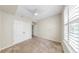 Neutral bedroom with a ceiling fan, window with blinds, and closet doors at 700 S Harbour Island Blvd # 226, Tampa, FL 33602
