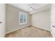 This bedroom offers neutral carpeting, bright natural light, and a ceiling fan at 700 S Harbour Island Blvd # 226, Tampa, FL 33602