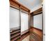 Organized walk-in closet with custom wood shelving and drawer space at 700 S Harbour Island Blvd # 226, Tampa, FL 33602