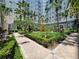 Lush landscaped courtyard featuring a central fountain, manicured hedges, and tiled walkways at 700 S Harbour Island Blvd # 226, Tampa, FL 33602