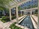 Beautiful courtyard with a water feature, pergola, seating, and tropical landscaping at 700 S Harbour Island Blvd # 226, Tampa, FL 33602