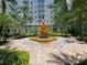 Serene courtyard featuring a tiered fountain, lush greenery, and elegant landscaping at 700 S Harbour Island Blvd # 226, Tampa, FL 33602