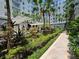 Beautiful courtyard with a pergola, flower pot, green foliage, and tiled walkways at 700 S Harbour Island Blvd # 226, Tampa, FL 33602