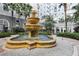 Stunning courtyard fountain surrounded by decorative gravel, trees, and landscaping at 700 S Harbour Island Blvd # 226, Tampa, FL 33602