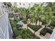 Tranquil courtyard with a water fountain, patio furniture, and a variety of plants at 700 S Harbour Island Blvd # 226, Tampa, FL 33602