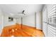 Open-concept living room with hardwood floors and view into kitchen with stainless steel appliances at 700 S Harbour Island Blvd # 226, Tampa, FL 33602