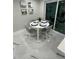 Cozy dining area with seating for four and bright natural lighting at 6220 Westport Dr, Port Richey, FL 34668