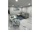 Comfortable living room area featuring a sectional sofa and marine-themed decor at 6220 Westport Dr, Port Richey, FL 34668