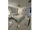 Comfortable main bedroom with soft lighting, ceiling fan and a large bed at 6220 Westport Dr, Port Richey, FL 34668